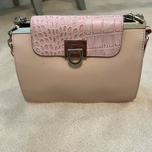Pink Ivanka Trump chain strap purse